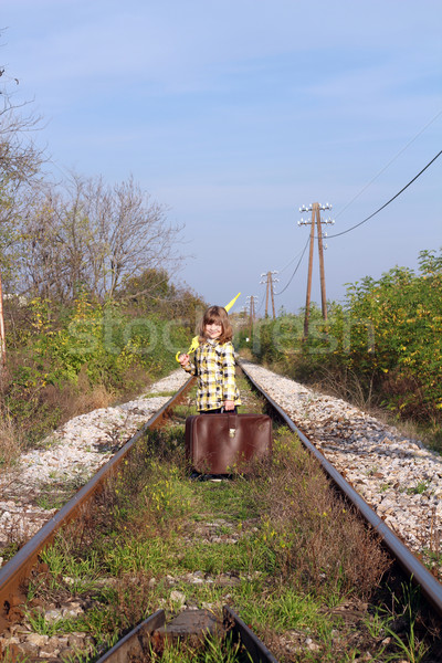 little girl with suitcase and umbrella standing on railroad Stock photo © goce