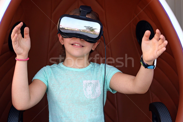 happy little girl with virtual reality headset on head Stock photo © goce