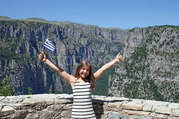 little girl with a Greek flag and thumb up on Vikos gorge Zagori Stock photo © goce