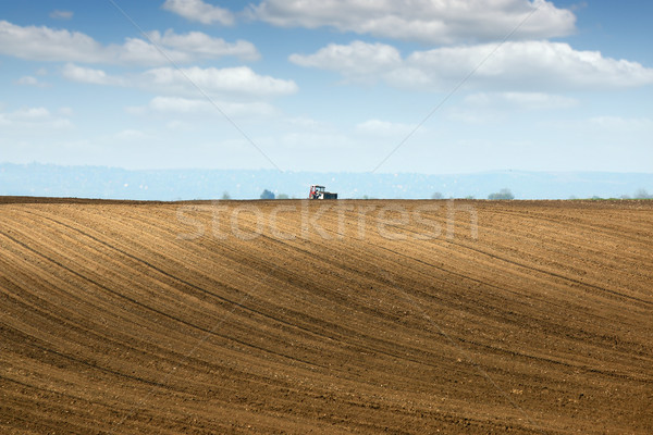 brown plowed field and tractor landscape Stock photo © goce