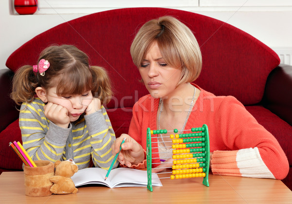 unhappy daughter and mother doing homework Stock photo © goce