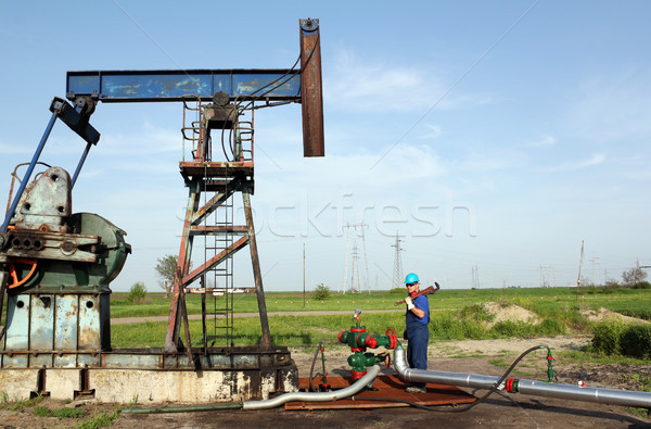 Stock photo: oil worker works on pipeline