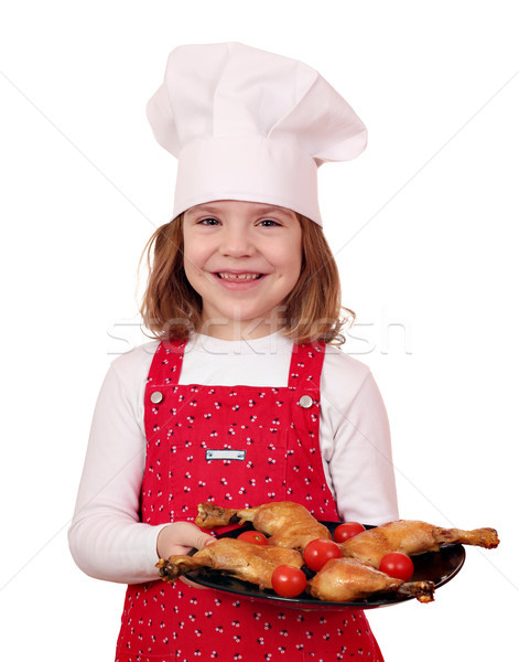 happy little girl cook with delicious chicken drumsticks Stock photo © goce