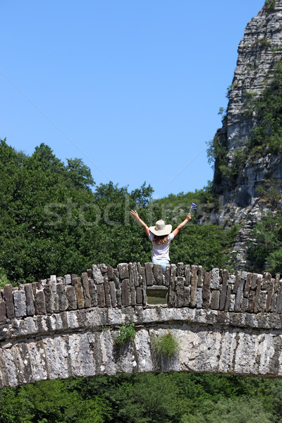 little girl with hands up standing on kokkori stone bridge Zagor Stock photo © goce