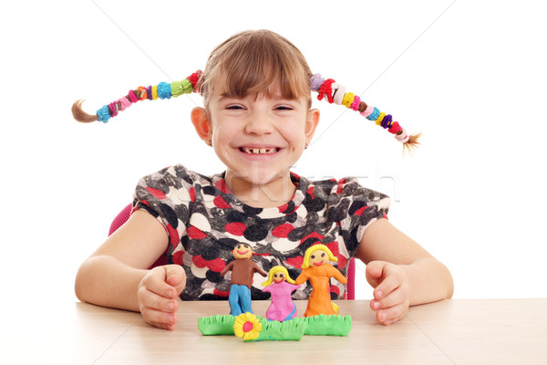 happy little girl make family figure with plasticine Stock photo © goce