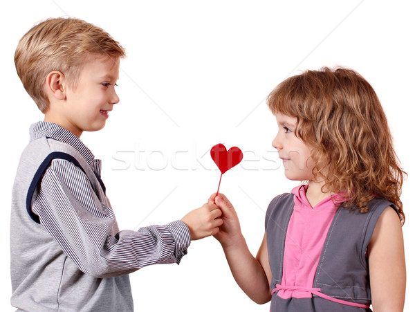 boy gives a little girl heart Stock photo © goce