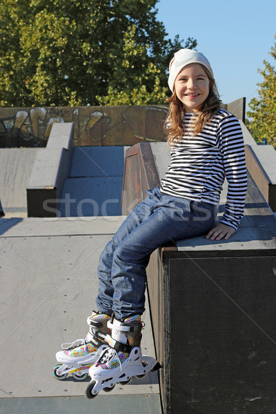little girl with rollerskates on playground Stock photo © goce
