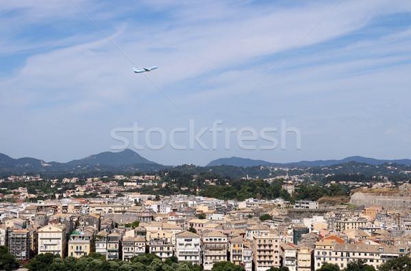 passenger airplane flying over Corfu town Greece Stock photo © goce