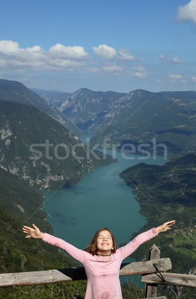 Stock photo: happy little girl with hands up on mountain enjoy in nature