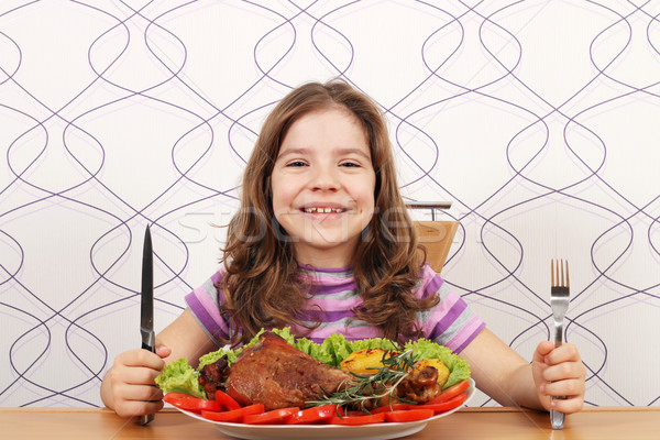 hungry little girl with turkey drumstick Stock photo © goce
