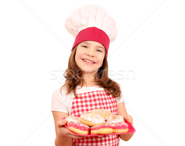 happy little girl cook with sweet donuts on plate Stock photo © goce