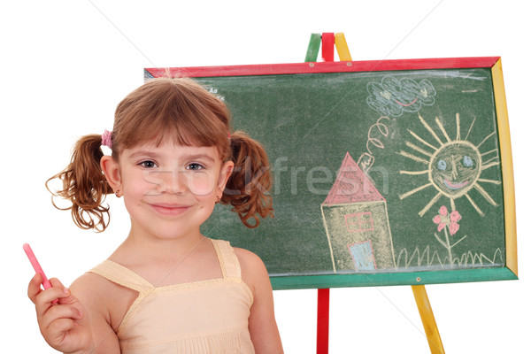 Stock photo: little girl drawing on board