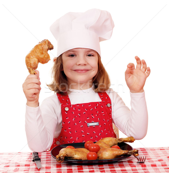 little girl cook with chicken drumstick Stock photo © goce