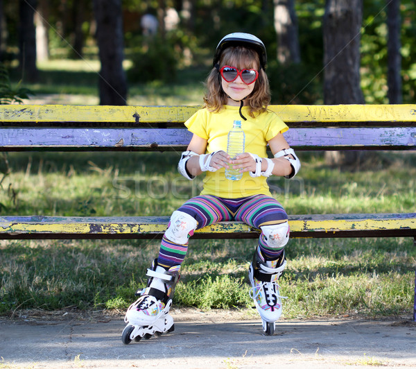 little girl with roller skates and water Stock photo © goce