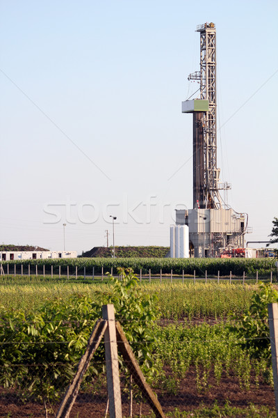Stock photo: oilfield with land oil drilling rig