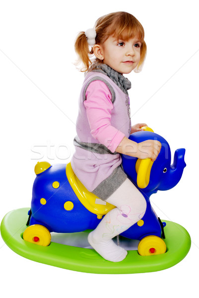 little girl riding elephant toy Stock photo © goce