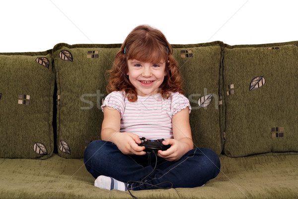 [[stock_photo]]: Petite · fille · jouer · jeu · vidéo · heureux · enfant · beauté
