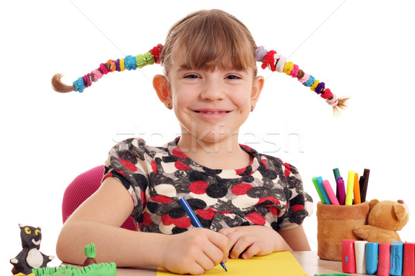 happy little girl with pigtails drawing Stock photo © goce