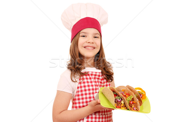Happy little girl cook with tacos on plate Stock photo © goce