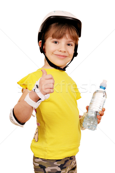 little girl with rolling skater protective gear and thump up Stock photo © goce