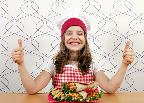happy little girl cook with burritos and thumbs up Stock photo © goce