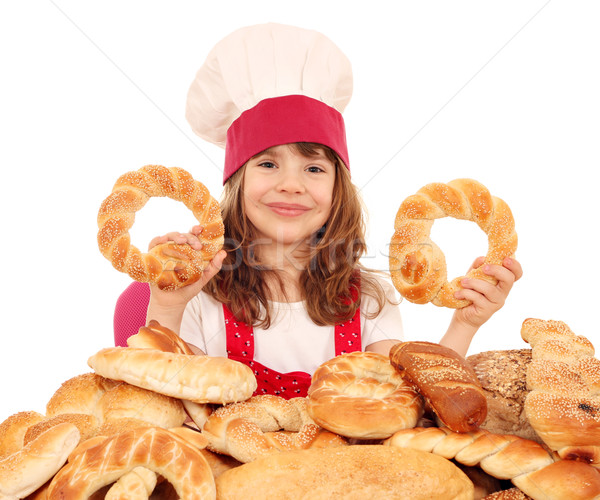 happy little girl cook with bread buns and rolls Stock photo © goce