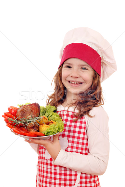 little girl cook with roasted turkey drumstick Stock photo © goce