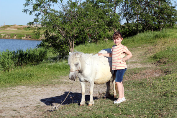 Little girl pónei cavalo animal de estimação menina campo Foto stock © goce