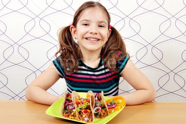 happy little girl with tacos on plate Stock photo © goce
