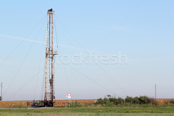 Stock photo: field with oil drilling rig industry