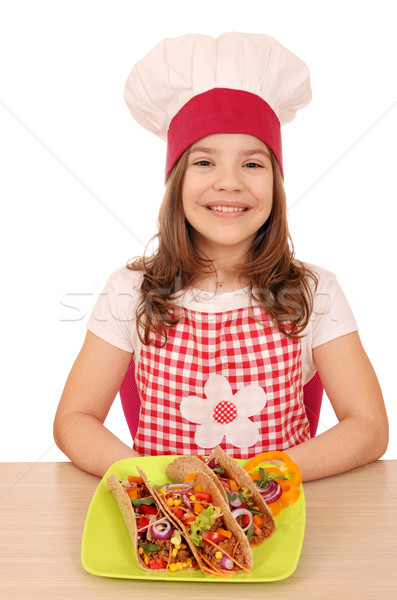 happy little girl cook with tacos on table Stock photo © goce