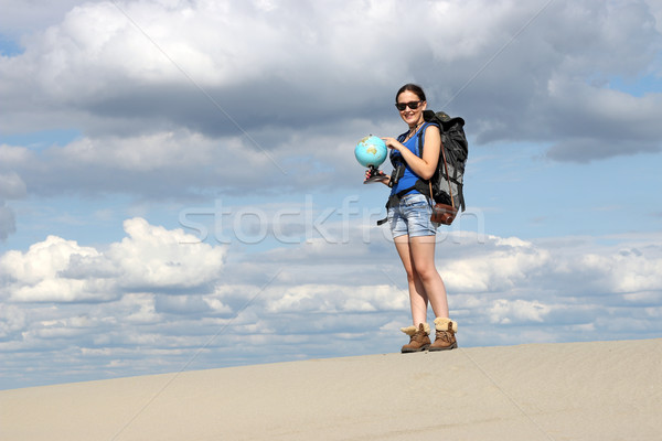 girl looking at a globe where they will travel Stock photo © goce