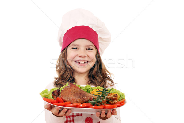 happy little girl cook with big turkey drumstick Stock photo © goce