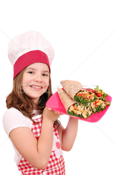 Stock photo: Happy little girl cook with burritos on plate