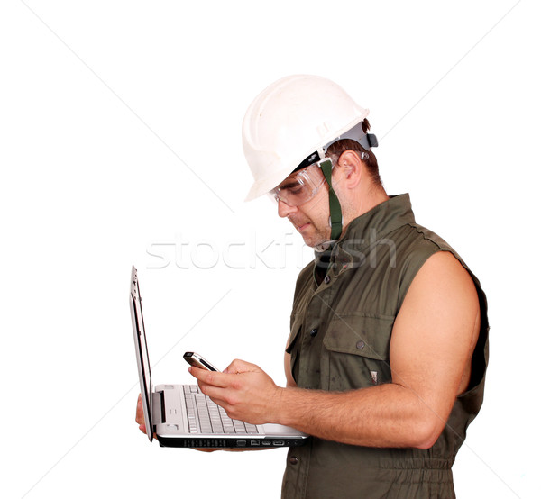 Stock photo: oil worker with laptop and phone on white 