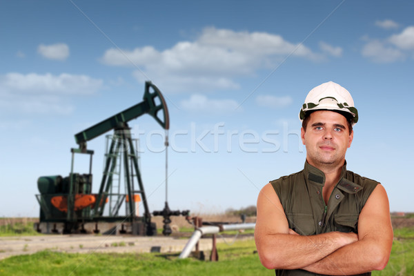 Stock photo: oil worker posing on oil field
