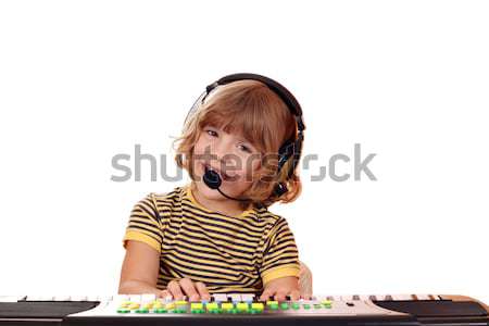 happy little girl sing and play keyboard Stock photo © goce
