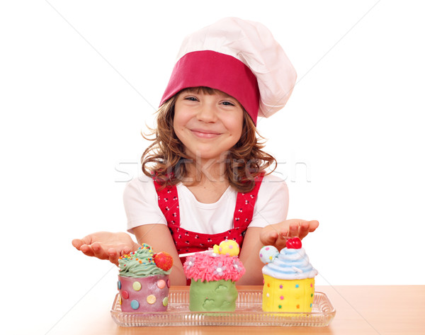 happy little girl cook with sweet cupcakes Stock photo © goce
