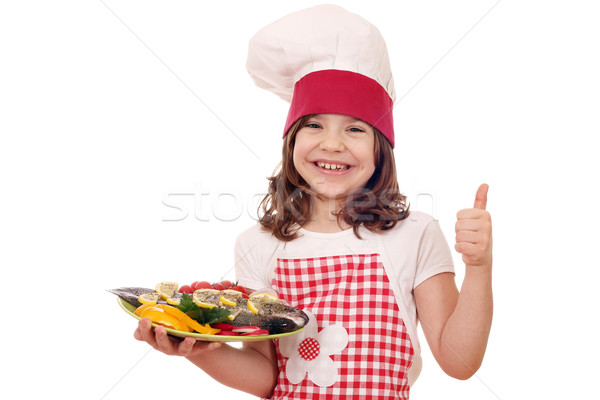 Feliz little girl cozinhar preparado truta polegar Foto stock © goce
