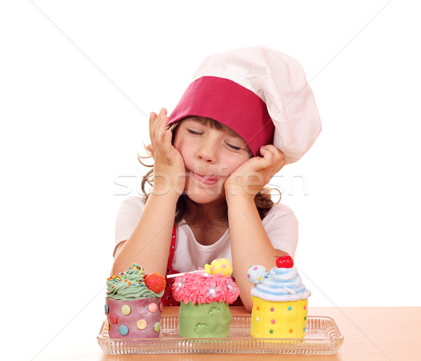 little girl cook enjoying sweet cupcakes Stock photo © goce