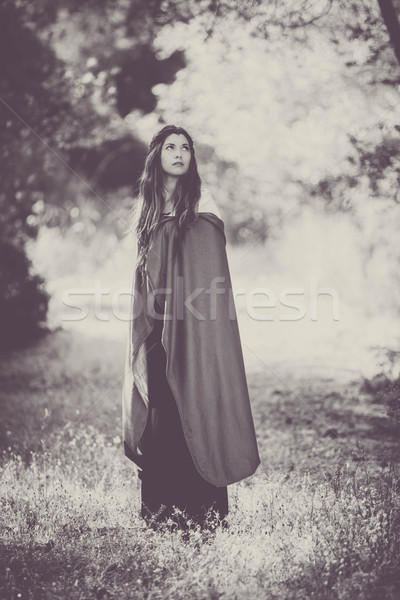 fiction woman in cloak in forest.  Stock photo © godfer