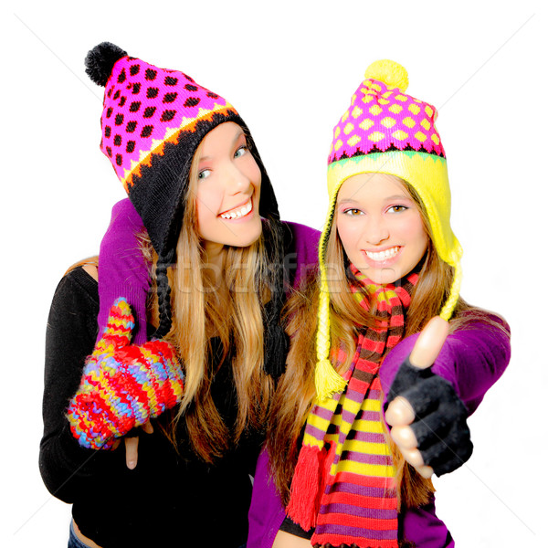 Happy smiling winter hat young women or girls Stock photo © godfer