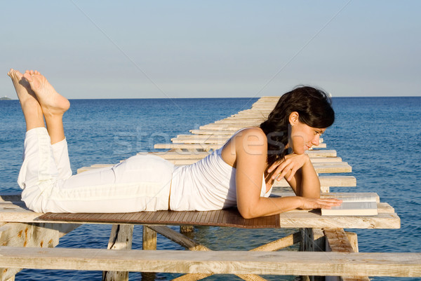 woman relaxing reading book on summer vacation Stock photo © godfer