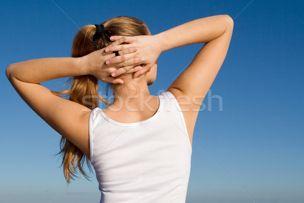 young woman doing stretching warm up exercises outdoors Stock photo © godfer