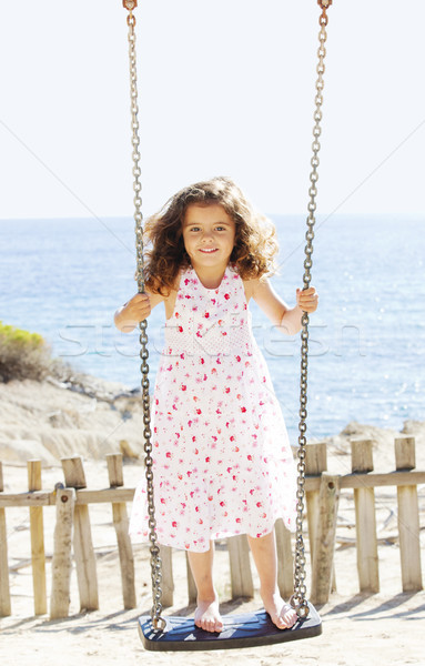 child playing swing on vacation Stock photo © godfer