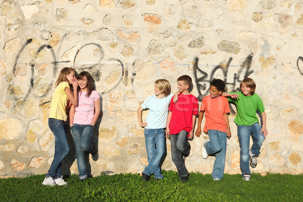 mixed race kids hanging out together Stock photo © godfer