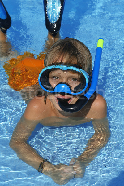 Szczęśliwy dziecko pływanie rurka do nurkowania wakacje Zdjęcia stock © godfer