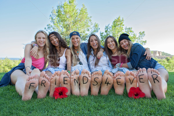 group of happy girls friends for ever Stock photo © godfer