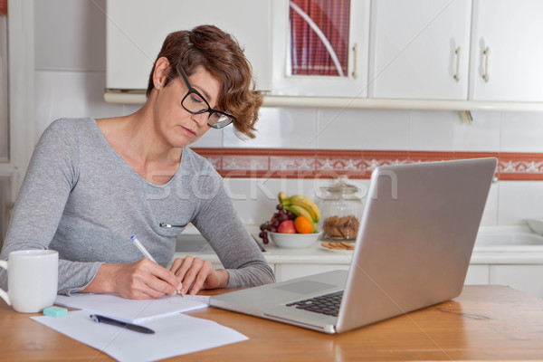 woman working or blogging in home office.  Stock photo © godfer