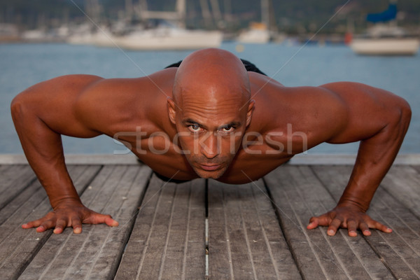 strong man doing press ups Stock photo © godfer